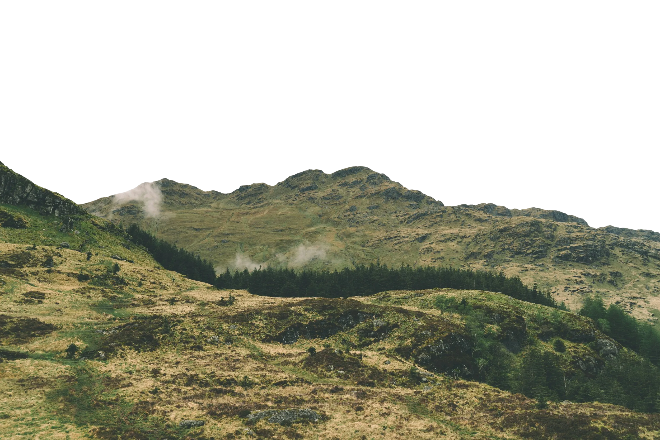 Two wind turbines on a ridge above low cloud, set against a large peach disc